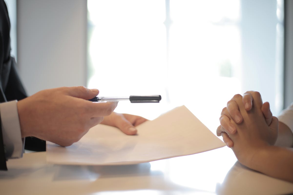 Close-up of hands reviewing a real estate contract