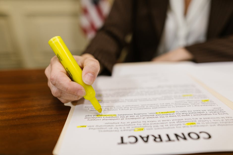 Close up of a hand reviewing a real estate contract during due diligence