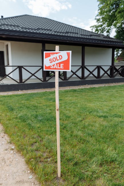 Modern house with a sold sign representing a successful cash offer company transaction