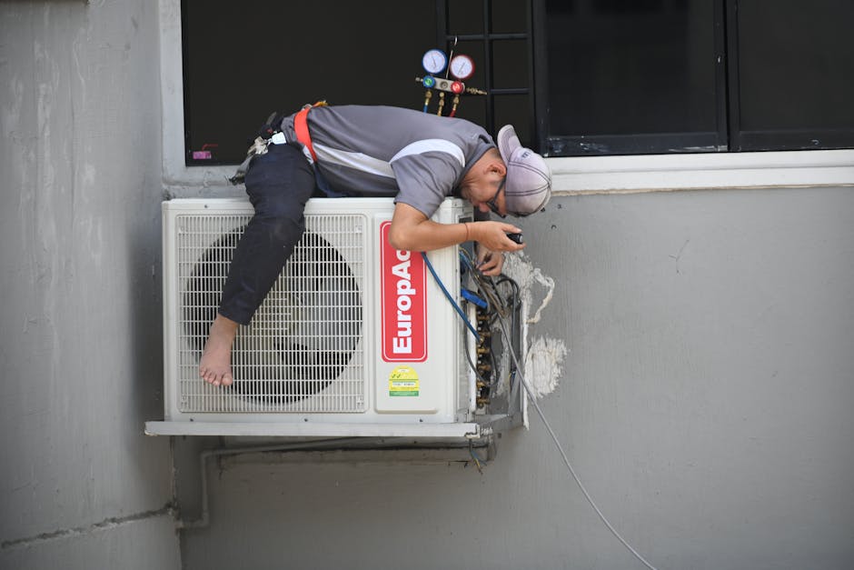 HVAC technician repairing an air conditioning unit covered by a home warranty