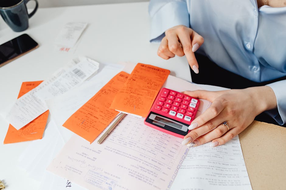 Calculating the costs of selling a house with receipts and calculator
