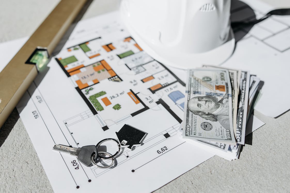 House keys and floor plan representing down payment planning for home purchase