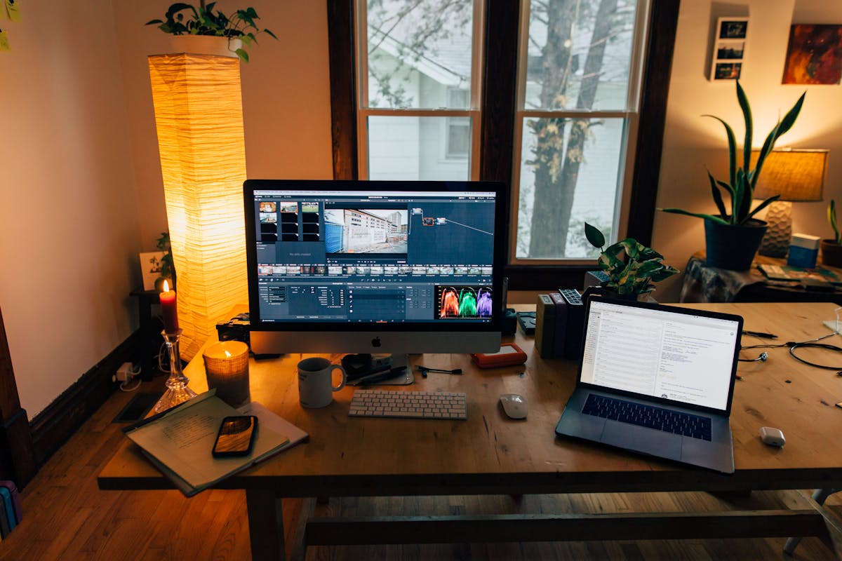 Modern home office setup with laptop and monitor ideal for remote workers